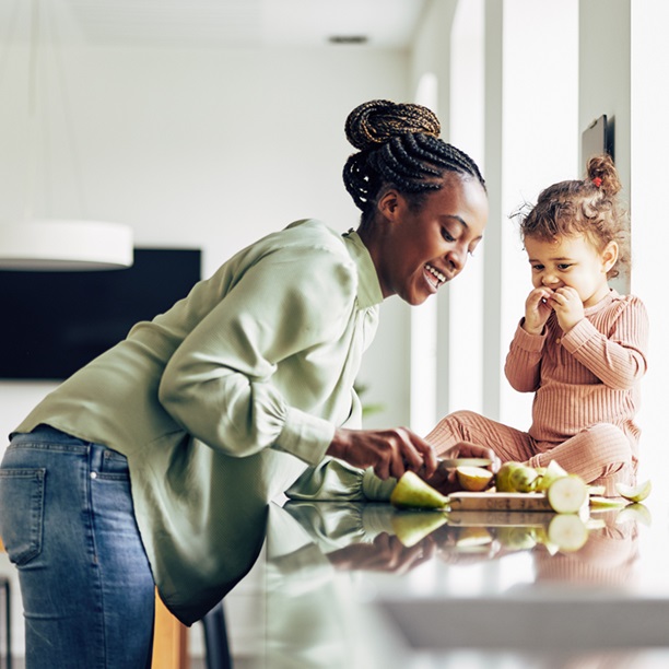 woman in kitchen with baby