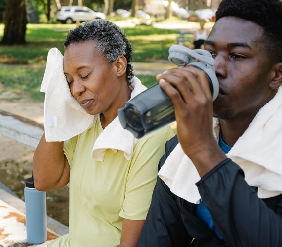 Woman and son drinking water