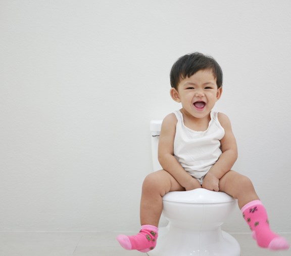 young toddler child upset while potty training
