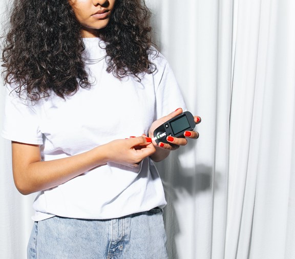 Woman checking a1c levels for diabetes.