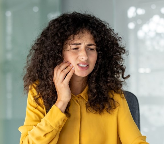 Woman of color with tooth ache trauma
