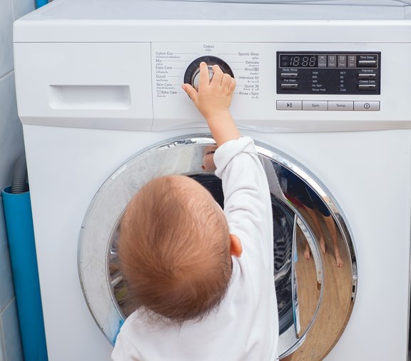 child trying to get into something childproofed.