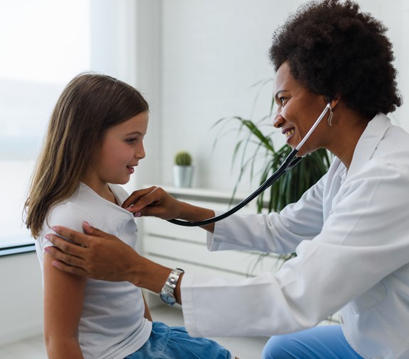 Girl at the pediatrician with doctor