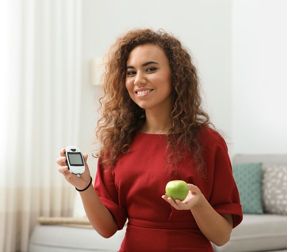 Young black woman taking care of her diabetes by healthy eating and an A1C test