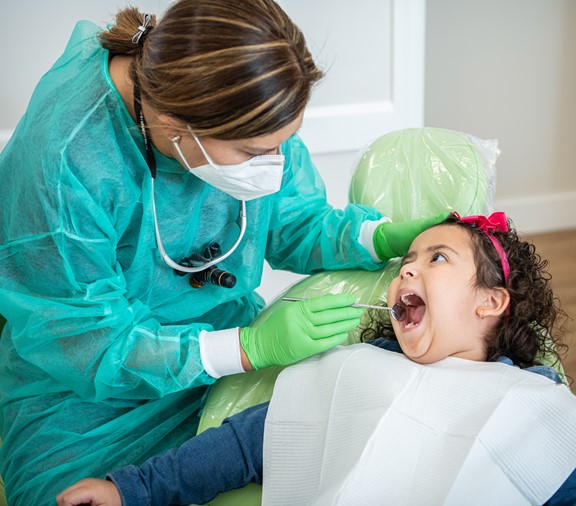 Child at dentist getting teeth cleaning