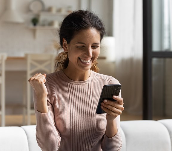 Woman of color excited about earning member rewards