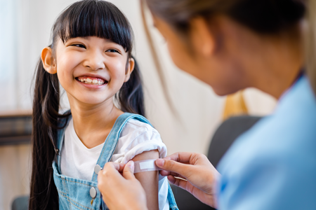 girl getting bandaid